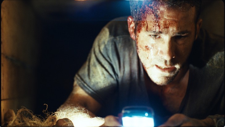 Ryan Reynolds ในบท Paul Conroy จากหนัง ภาพยนตร์ Buried 